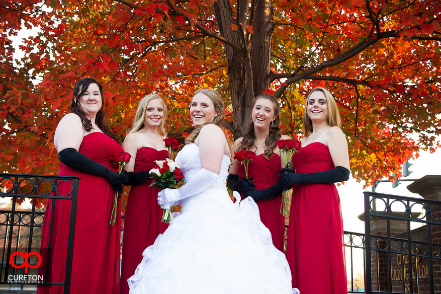 Bride and bridesmaids posing in downtown Greer,SC.