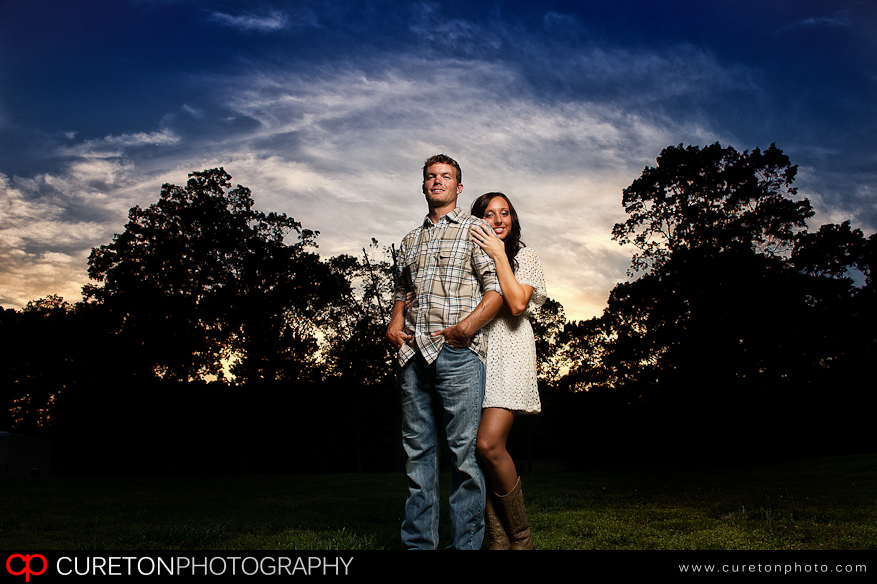 Epic sky and a couple posing at sunset.