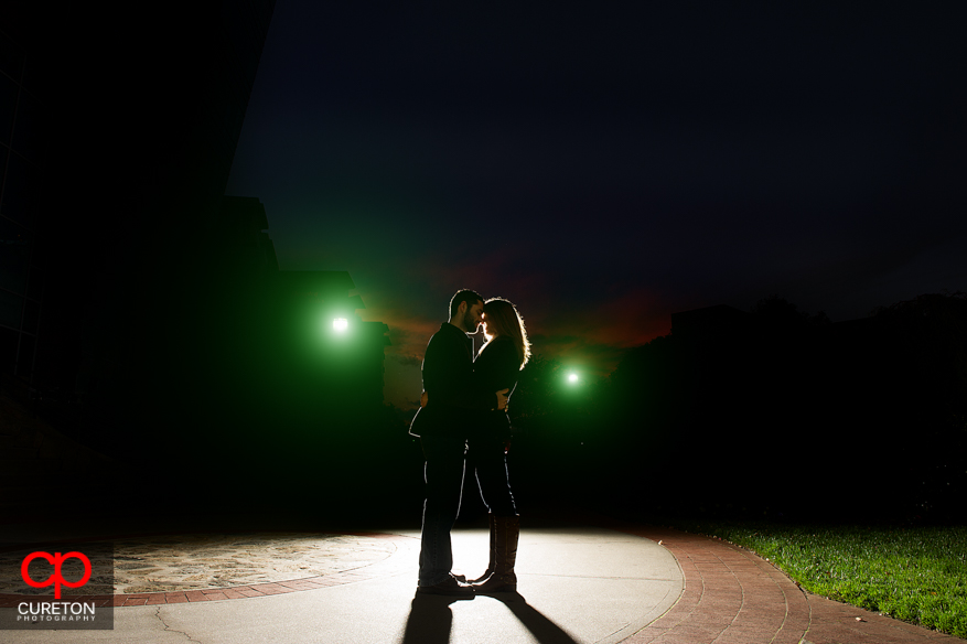 Silhouette of a couple in Falls Park during their engagement session.