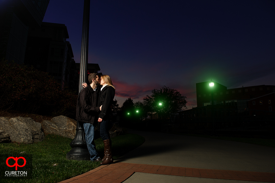 Couple standing near the Reedy River during a recent engagement session.