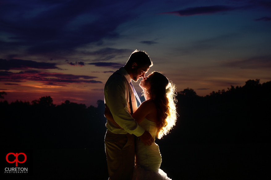 Gorgeous sunset photo of bride and groom. 