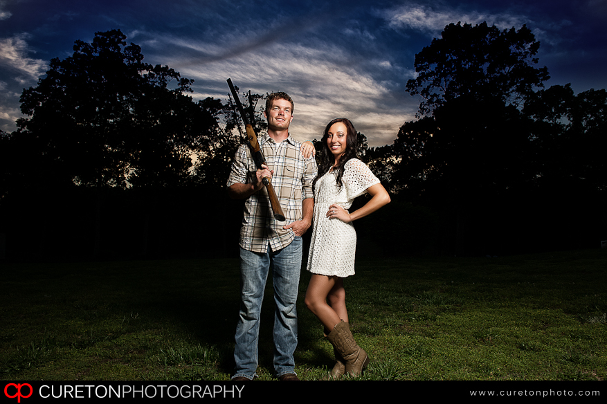 Great creative engagement session with the groom to be holding a shotgun.