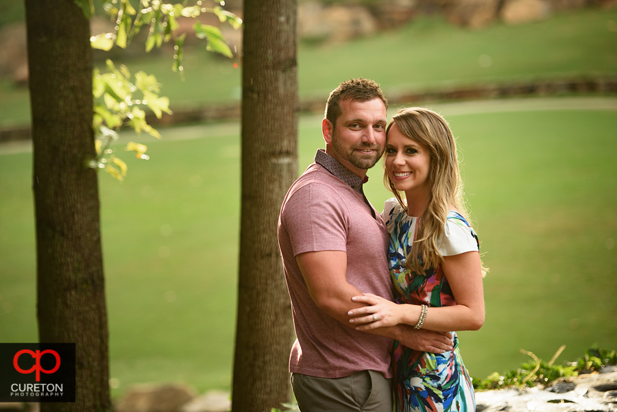 Couple hugging in Falls Park.