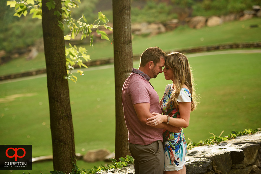 Couple forehead to forehead staring into each others eyes.