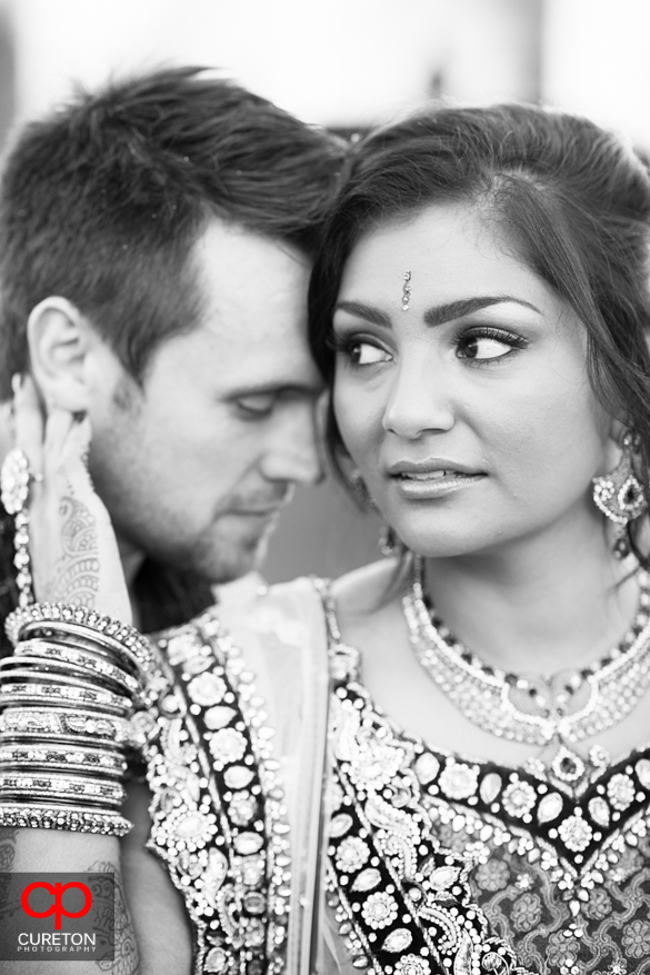 Bride and groom pose after their first look in Simpsonvillle,SC at the Loom.