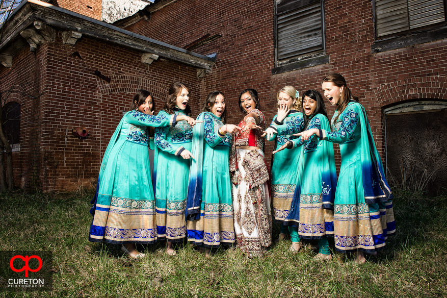 Bride and bridesmaids pose outside the Loom in Simpsonville.