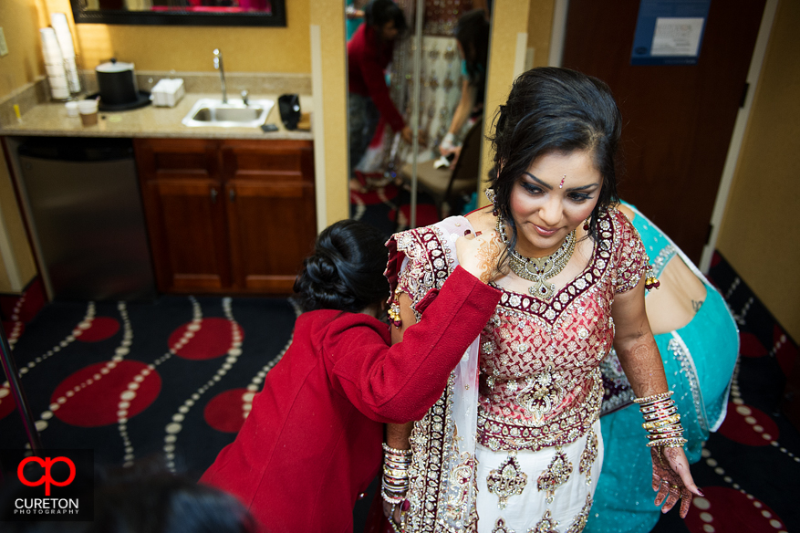 Bride's family help the bride get ready.