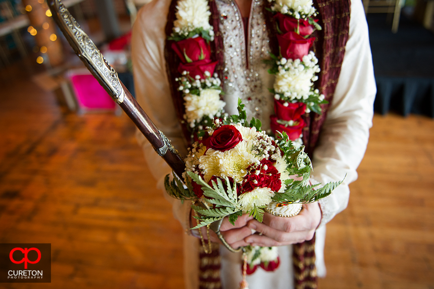 Groom with sword before his processional.