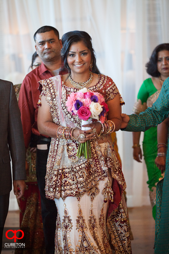 Beautiful Indian bride walks down the aisle.