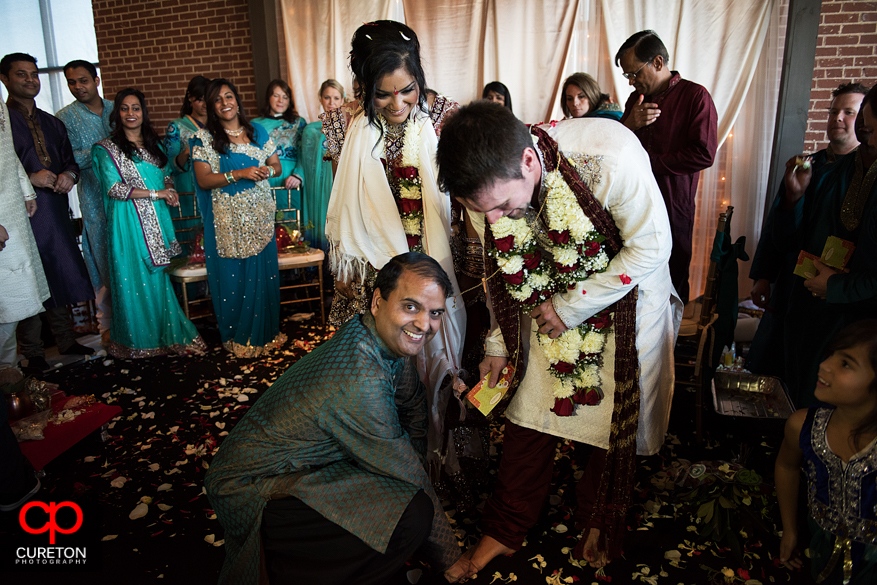 Brides cousin kidding around with the groom.