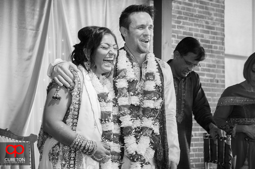 Bride and groom share a laugh during the ceremony.