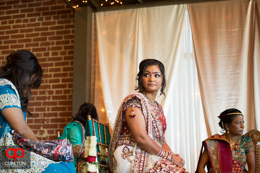 Indian bride looks away during the ceremony.