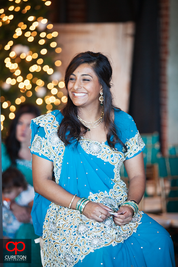 Brides sister look on during the ceremony.