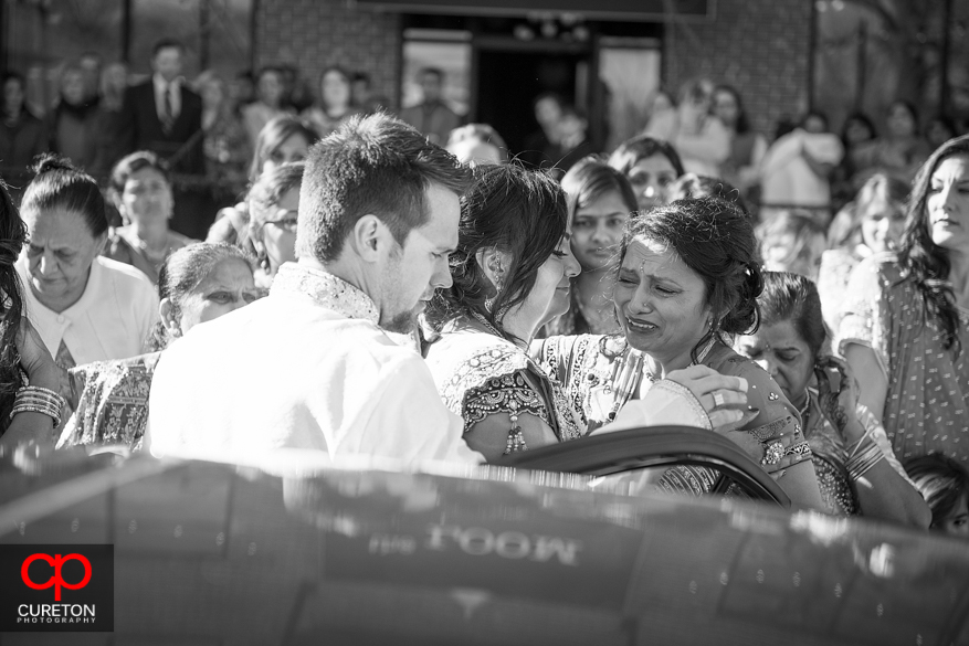 Bride's cousin cries as the bride and groom leave the ceremony.