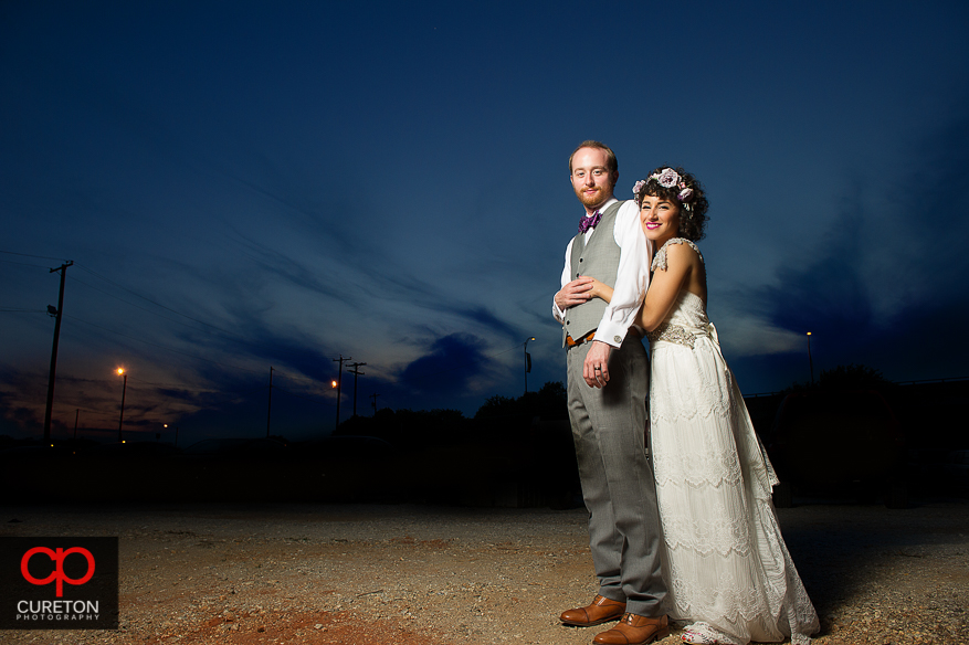 Couple hugging at sunset after their Huguenot Loft Wedding in downtown Greenville,SC. 