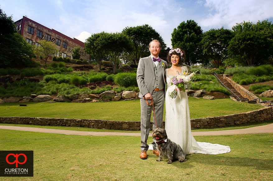 Couple and their dog in Falls Park before their wedding.