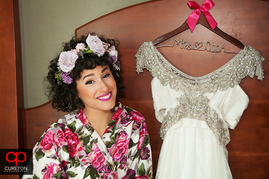 Bride posing with dress in downtown Hampton Inn.