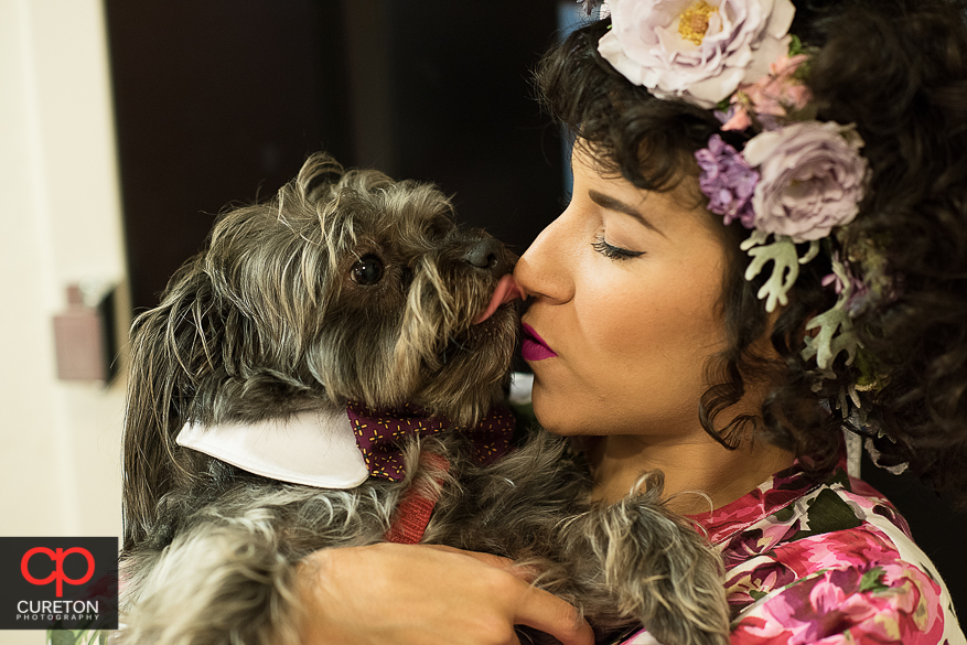 Bride posing with her dog.