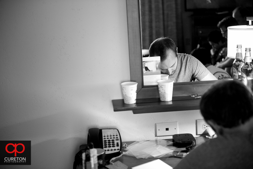 Groom writing letters to his groomsmen.