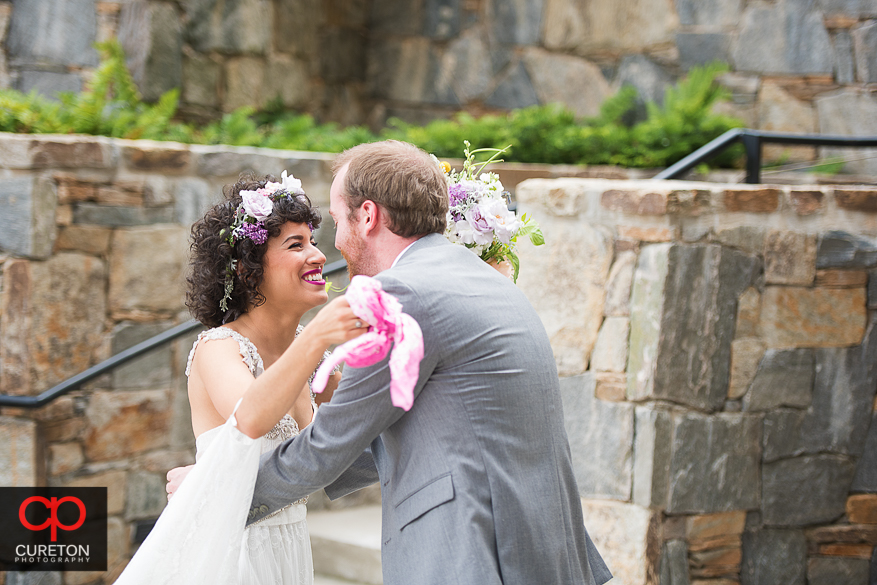 Bride an groom share a first look in downtown Greenville.