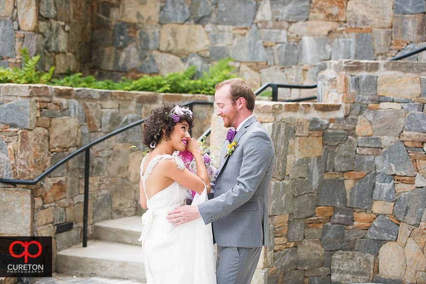 Bride wipes her eyes during the first look.