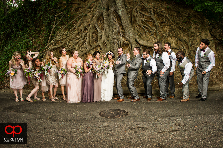 Creative wedding party photo at Falls Park in downtown Greenville.