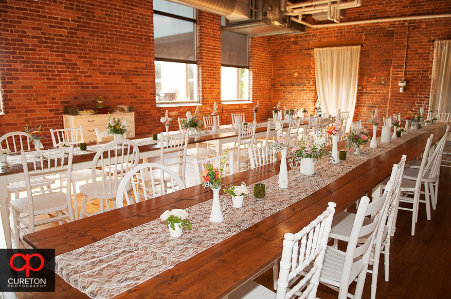 Vintage farmhouse tables in the Huguenot Loft.