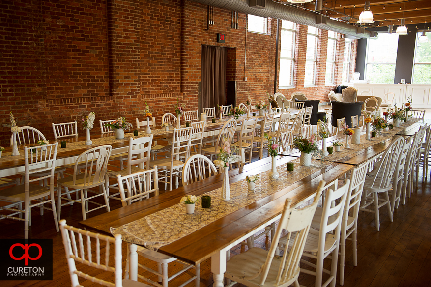 Farmhouse tables setup for the wedding reception.