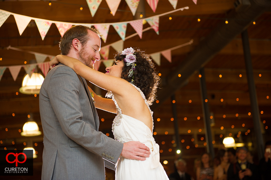 Couple haing their first dance as a married couple.