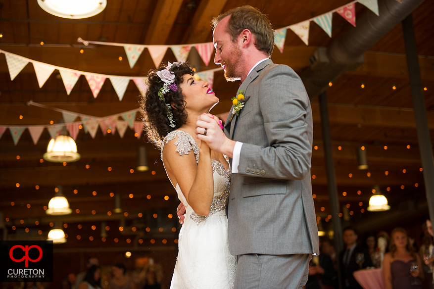 Bride and groom dancing.