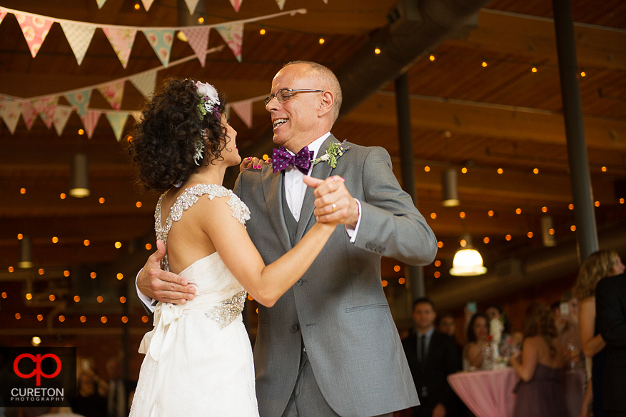 Bride dances with her father.