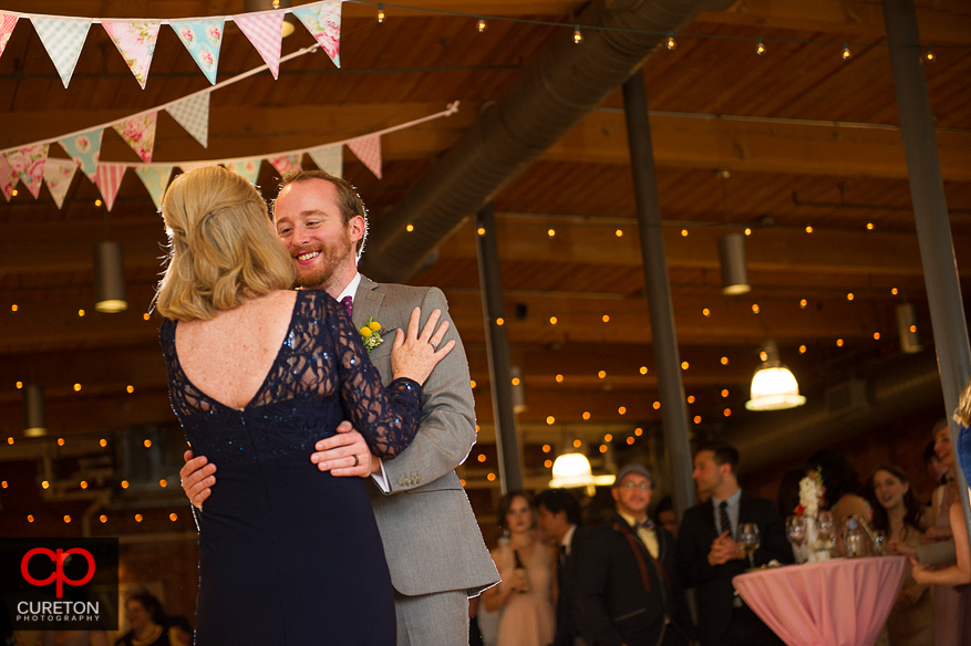 Groom dancing with his mother.