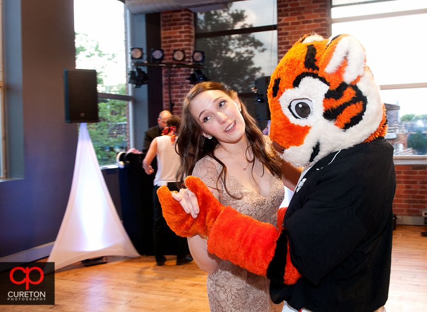 Clemson tiger cub dancing with wedding guests.