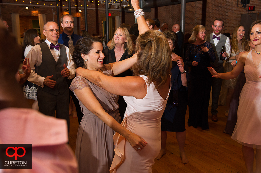 Guests dancing as Uptown Entertainment plays the wedding reception at Certus Loft.