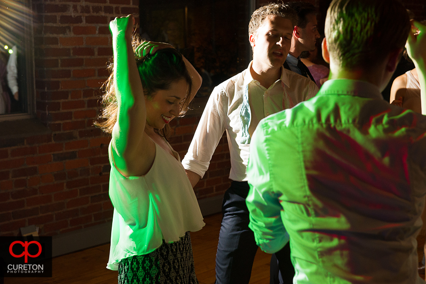 Guests dancing as Uptown Entertainment plays the wedding reception at Certus Loft.