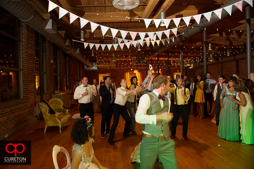 Groom tossing the garter.