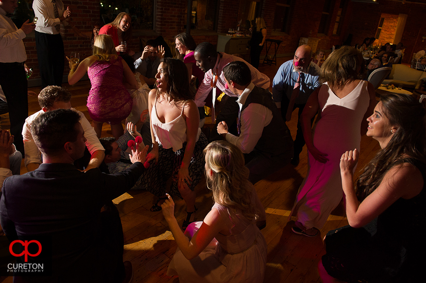 Guests dancing as Uptown Entertainment plays the wedding reception at Certus Loft.