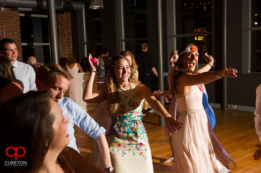 Guests dance at the Huguenot Loft wedding reception in downtown Greenville,SC.