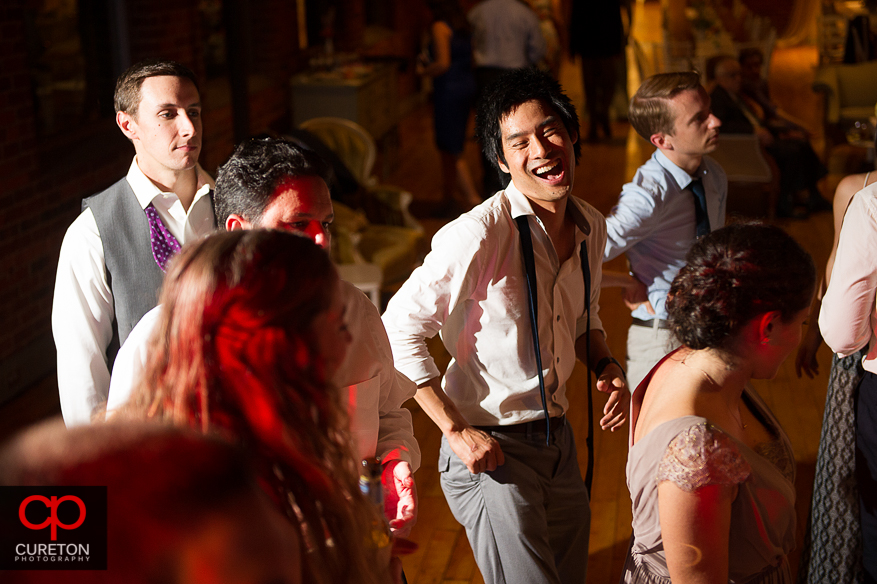 Guests dance at the Huguenot Loft wedding reception in downtown Greenville,SC.