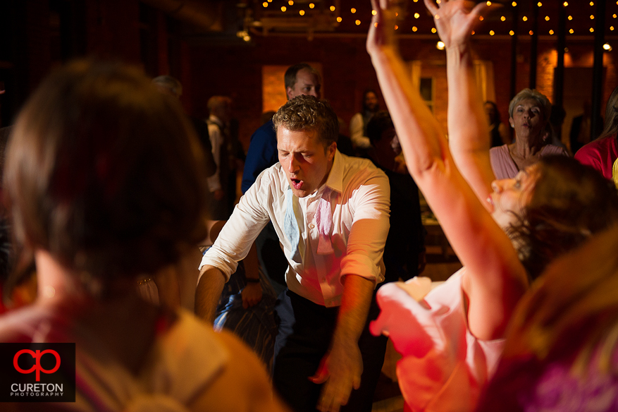 Guests dance at the Huguenot Loft wedding reception in downtown Greenville,SC.