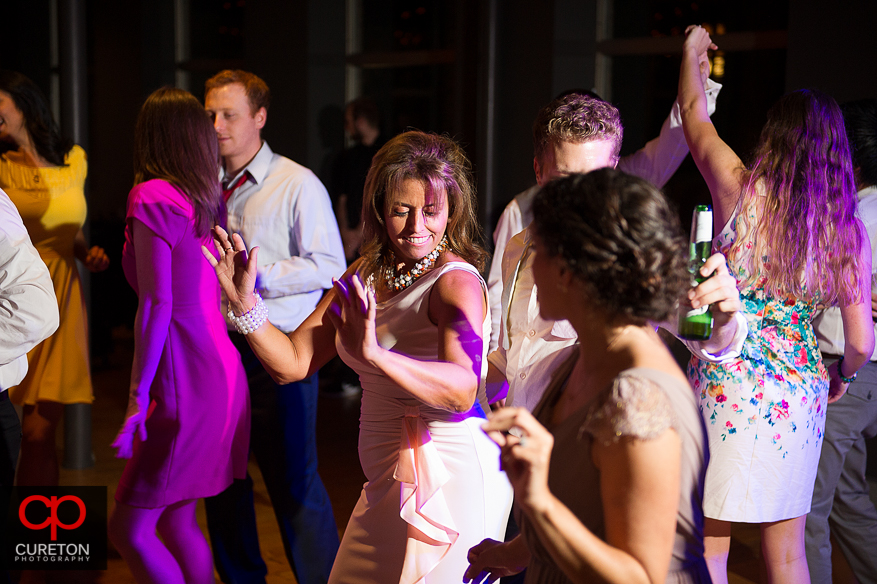 Guests dance at the Huguenot Loft wedding reception in downtown Greenville,SC.