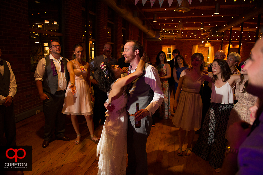 Guests dance at the Huguenot Loft wedding reception in downtown Greenville,SC.