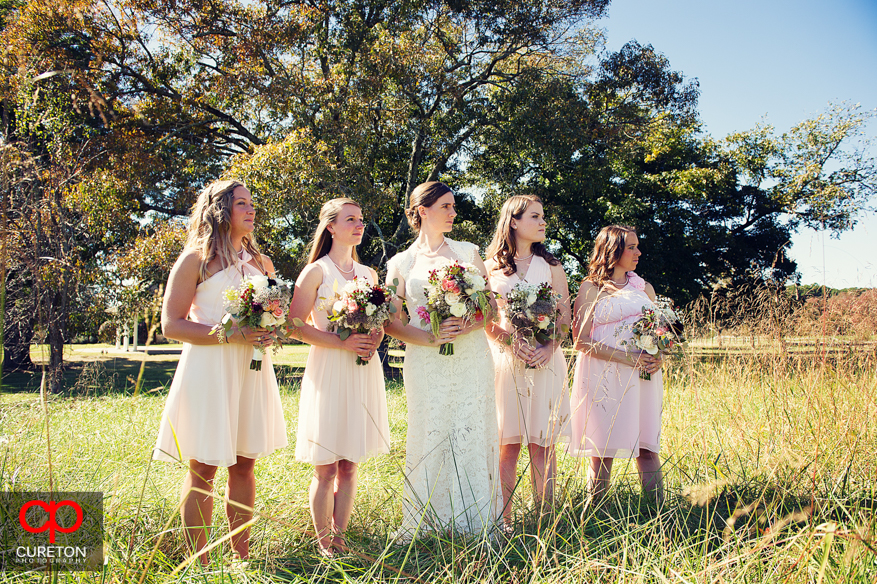 Bride and bridesmaids before a wedding at Lenora's Legacy.
