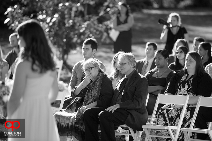 Brides mother looks on during the ceremony.