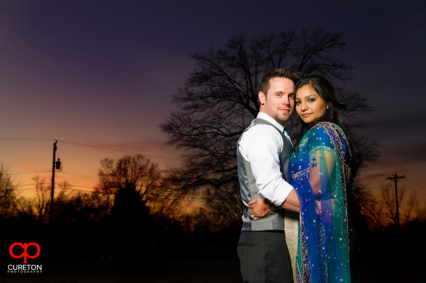 Couple posing at sunset after their Greenville SC Indian Wedding.