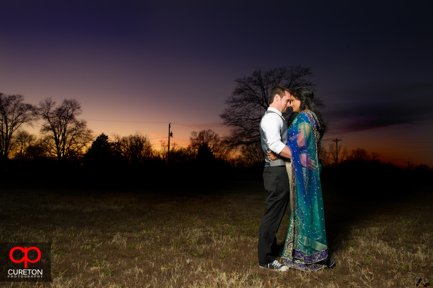 Bride and Groom at sunset with amazing sky colors.