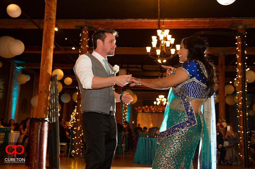 Groom and Bride dancing.