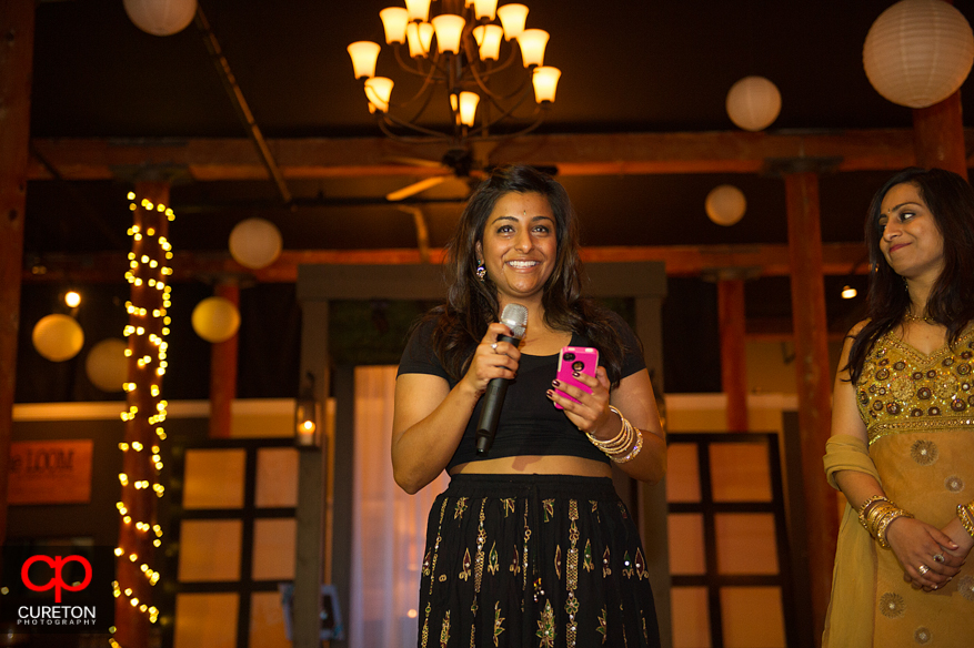 Bride's sister giving a toast at the reception.