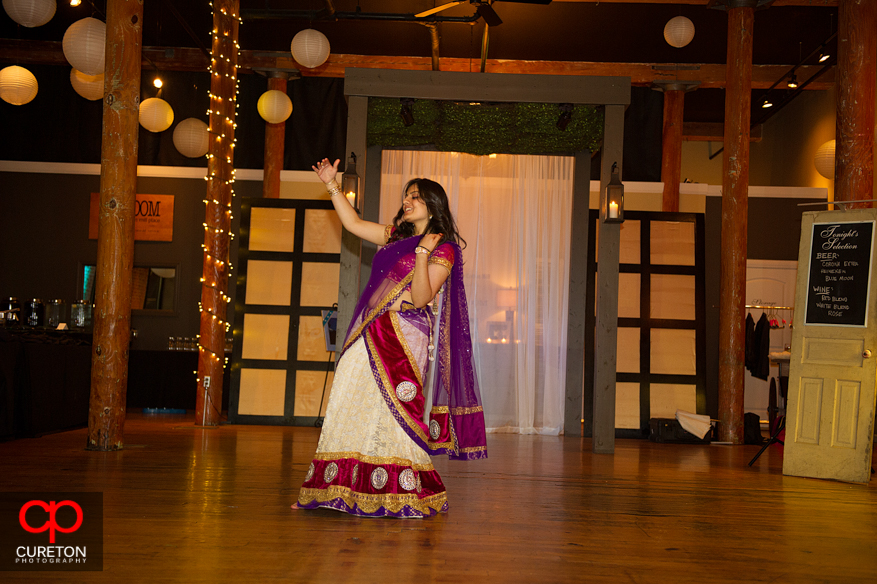 Bride's cousin dances for her at the reception.