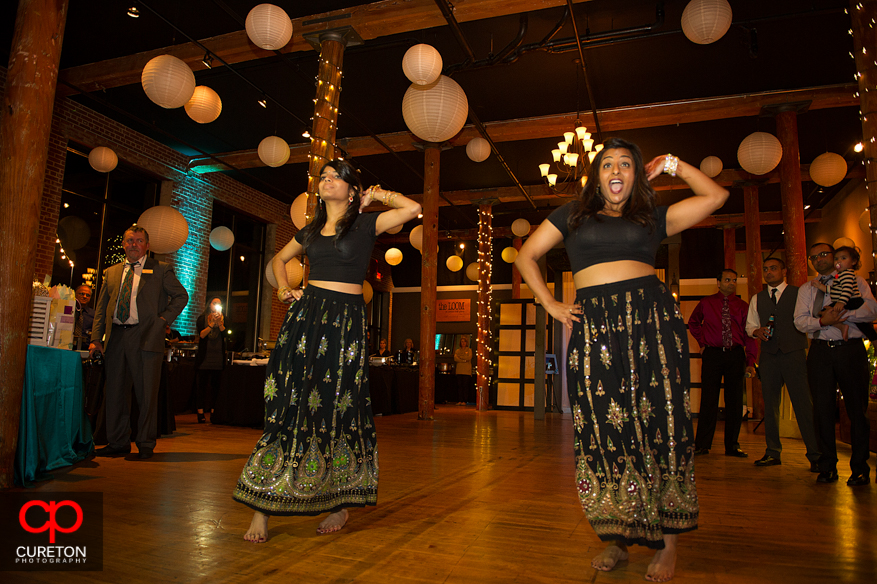 Bride's sister perform Indian dance for her at the reception.